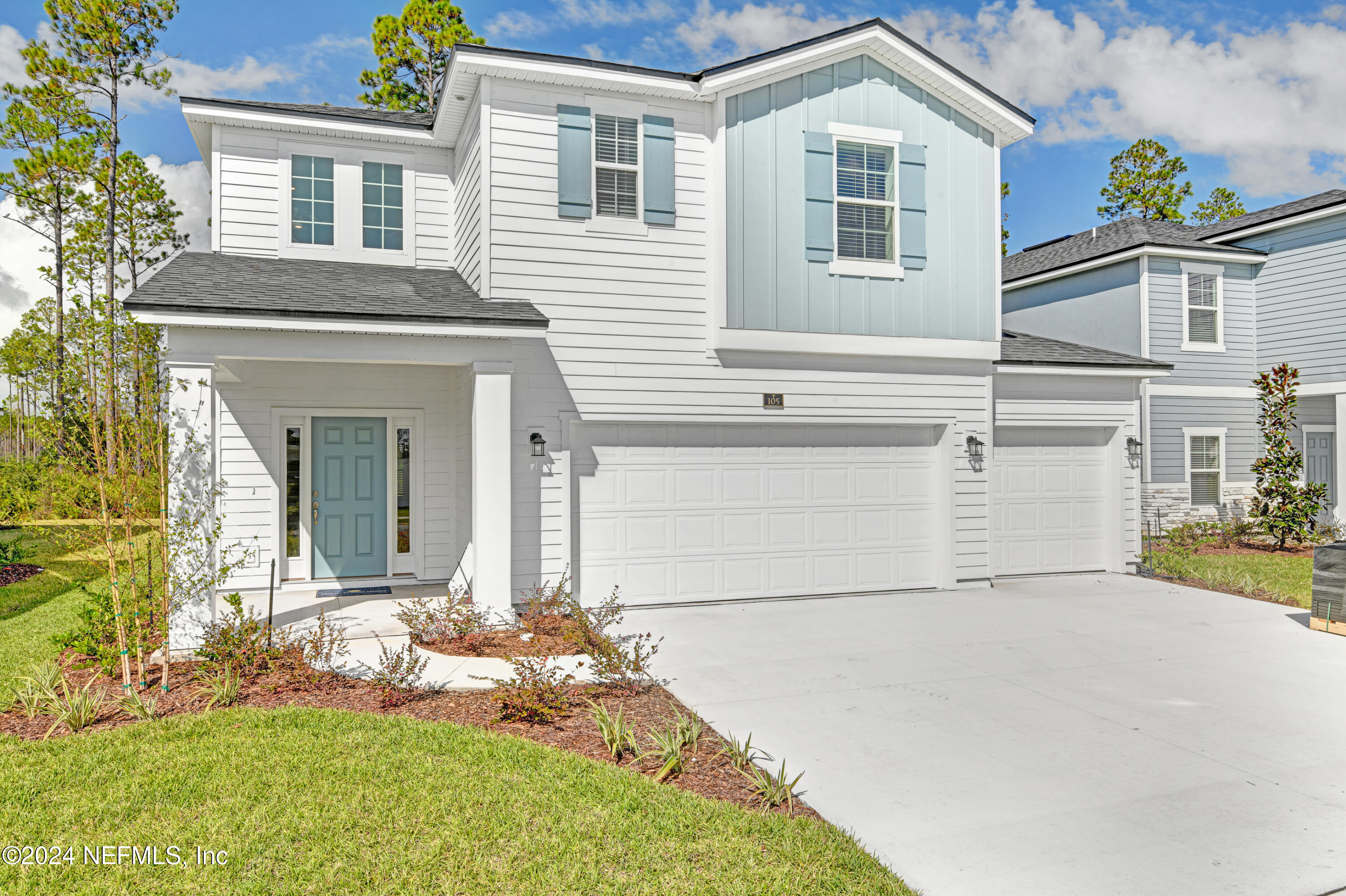 front view of a house with a yard