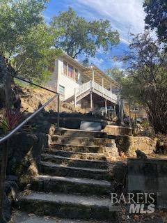 a view of a house with a yard