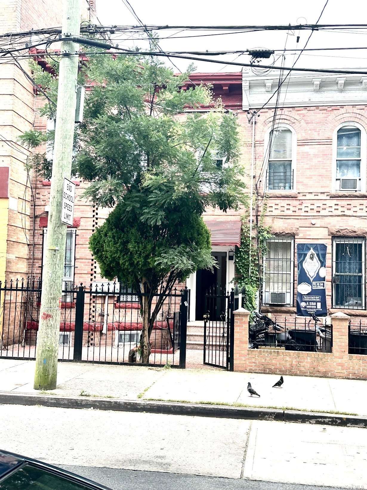 a view of a brick house with large windows