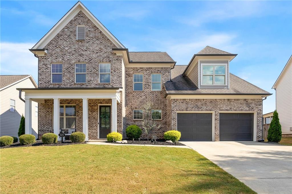 front view of a house with a yard