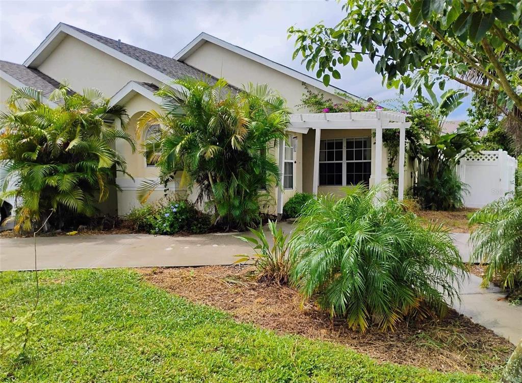 a front view of a house with garden