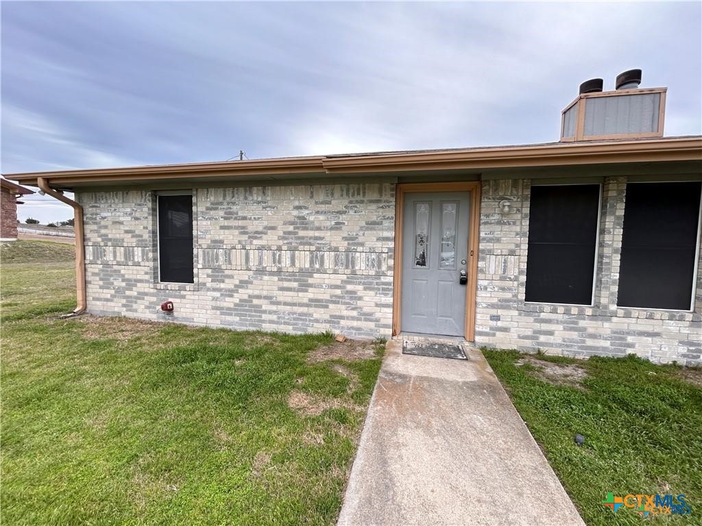 a front view of a house with yard