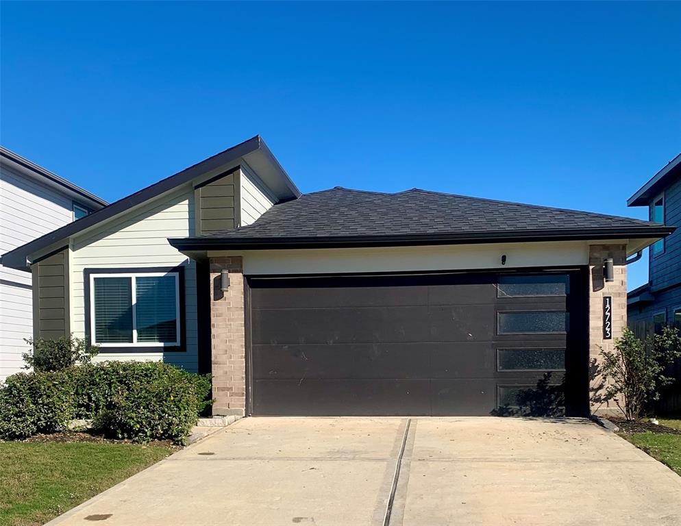 a front view of a house with a garage