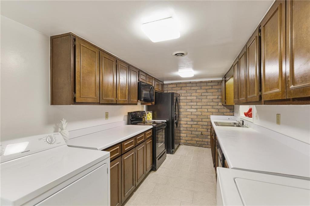 a kitchen that has a sink and a stove