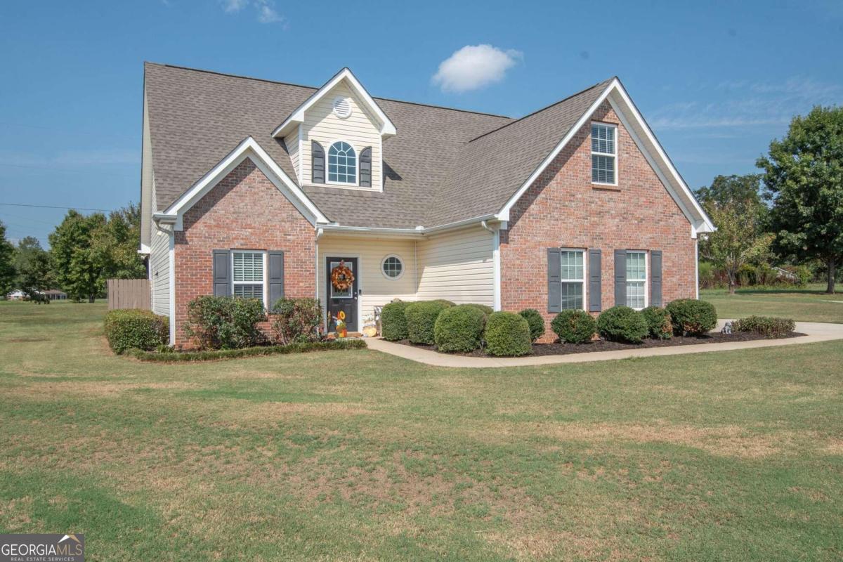 a front view of a house with a yard