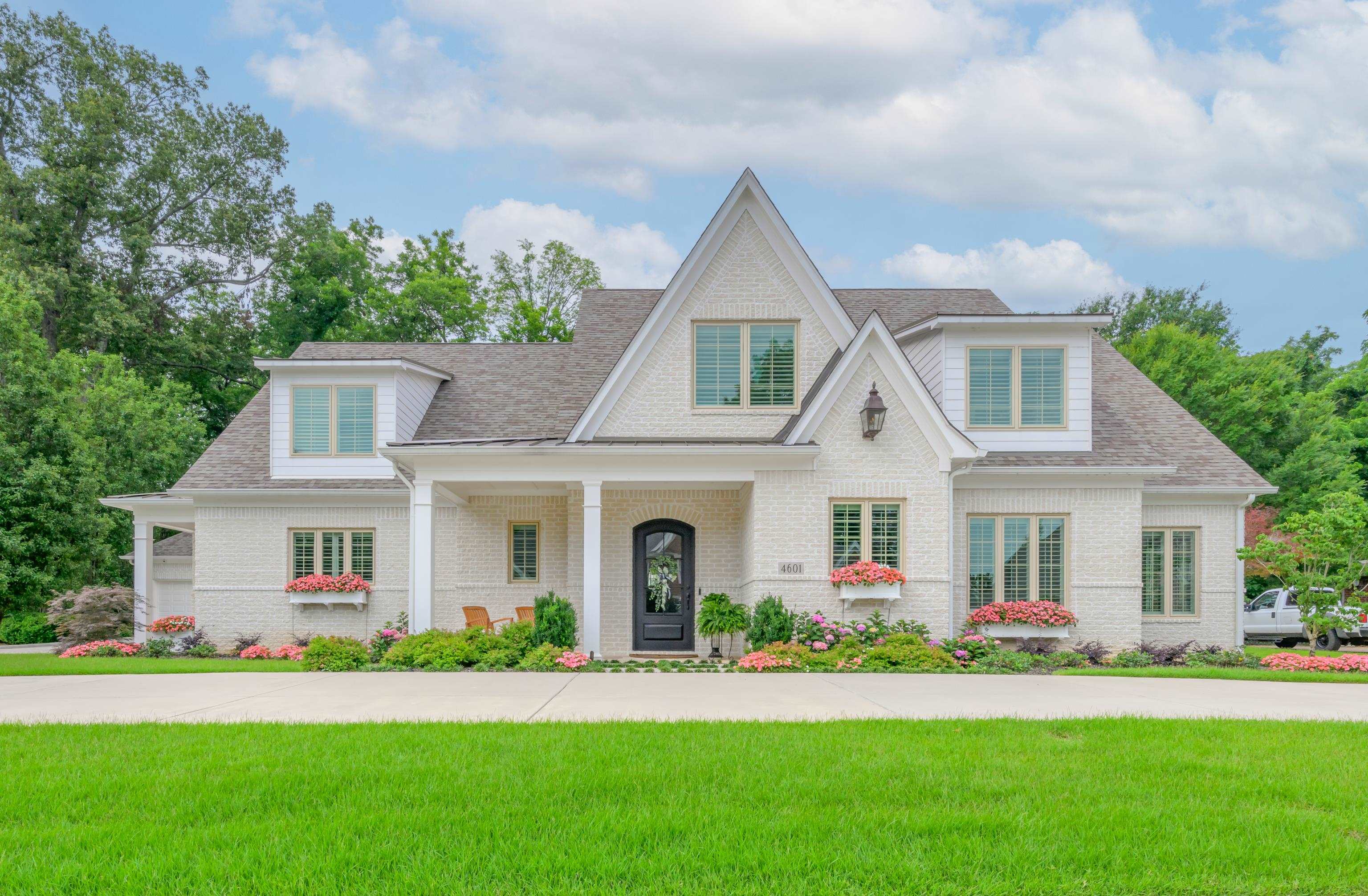 front view of a house with a yard