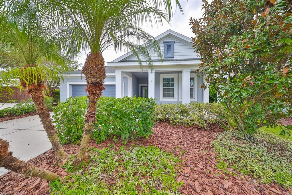 a front view of a house with garden