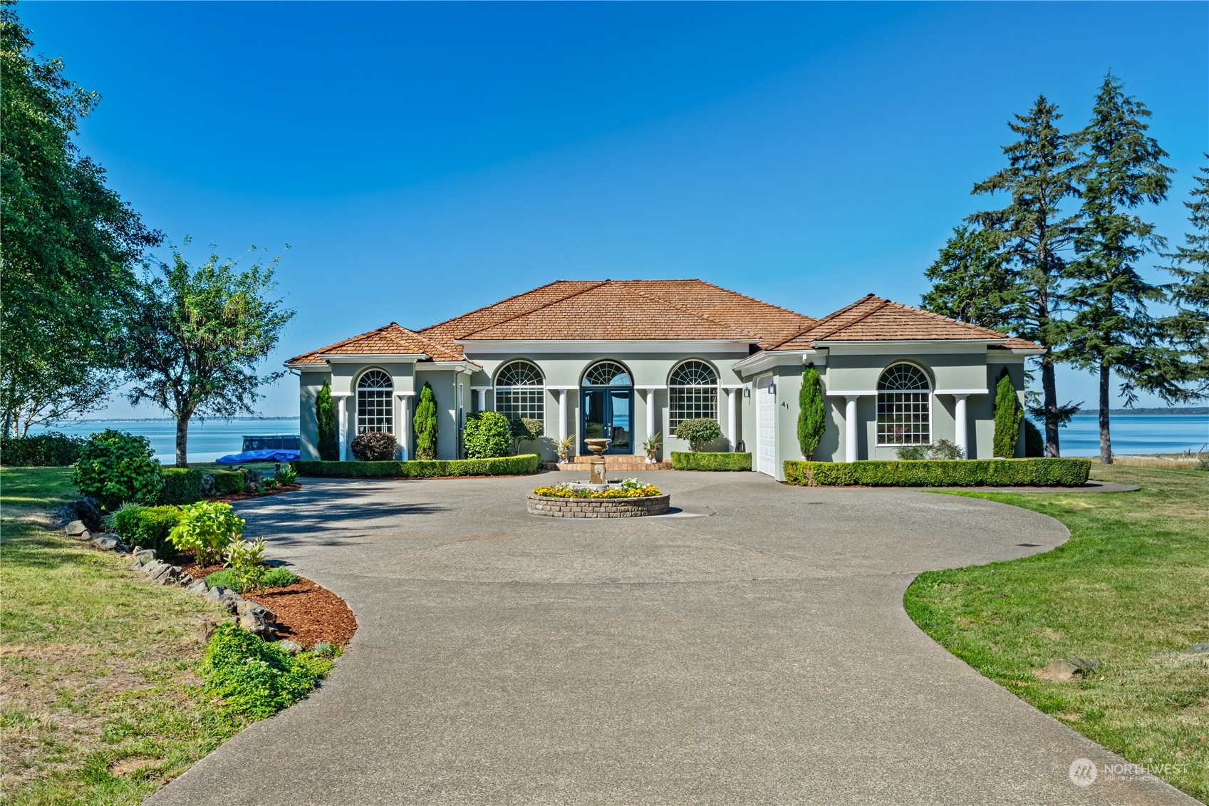 a front view of a house with yard