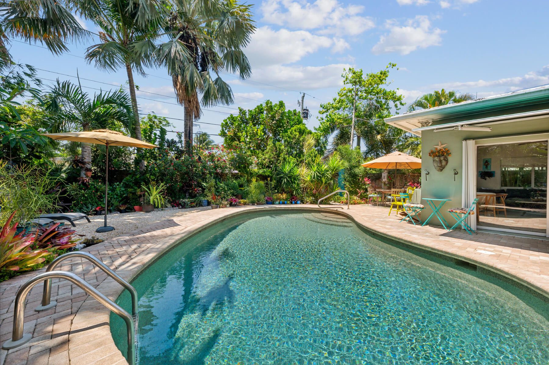 a swimming pool with outdoor seating and yard