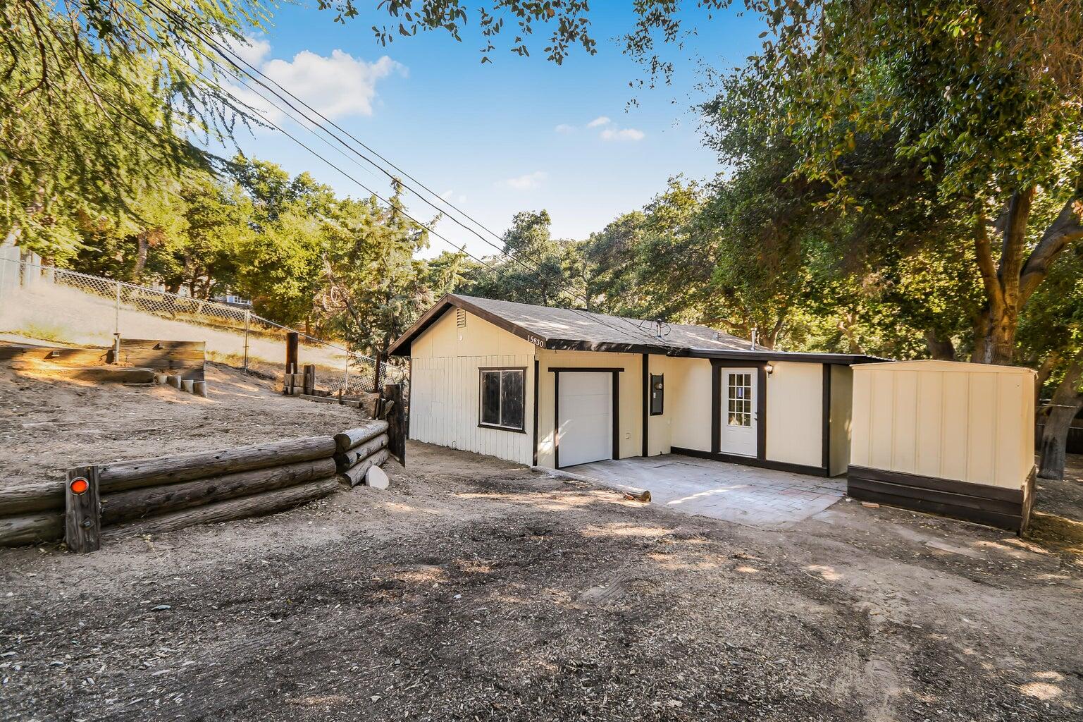 a view of a house with a backyard