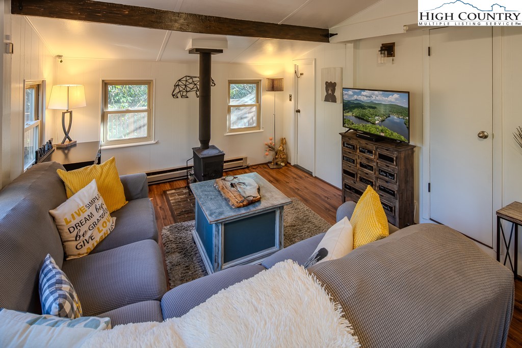 a living room with furniture and a flat screen tv