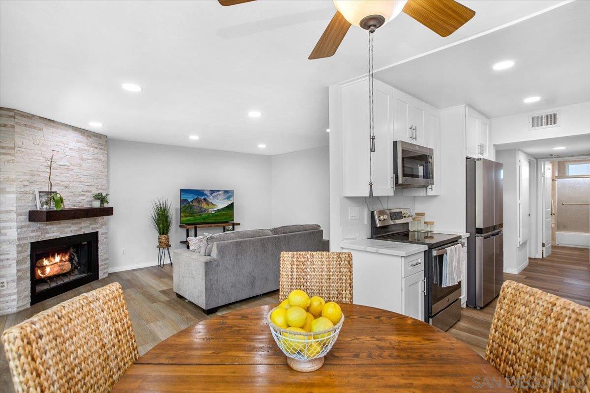 a kitchen with microwave a stove and refrigerator