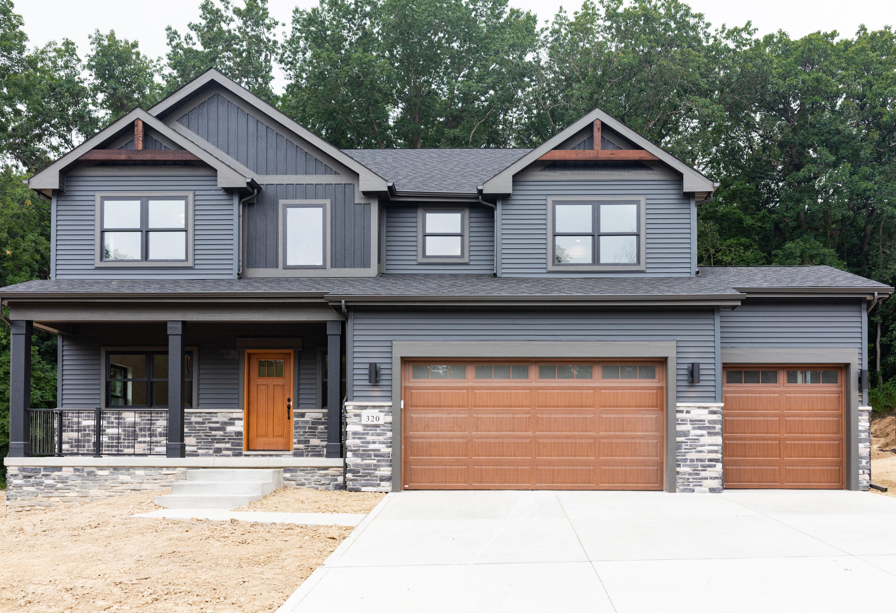 a view of a house with a garage and windows