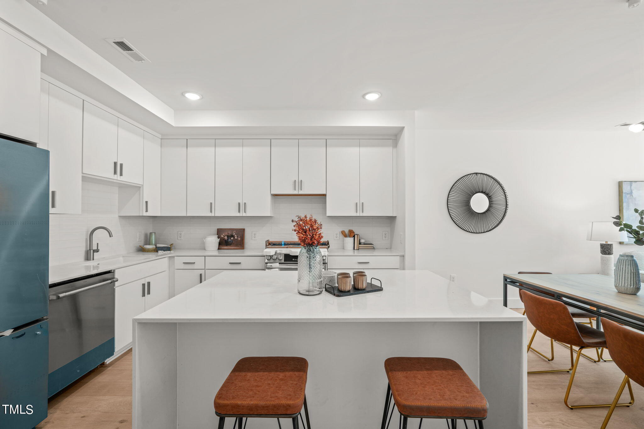 a kitchen with a sink cabinets and appliances