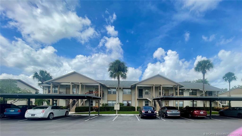 a view of a car park in front of house