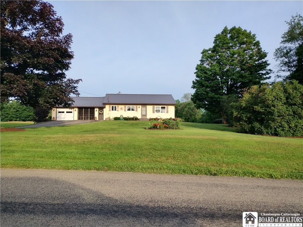 Front of house from road - double garage with summ