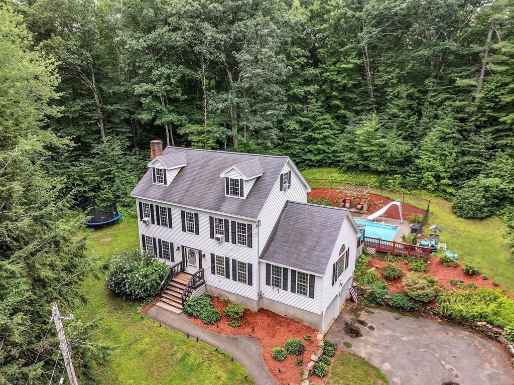 an aerial view of house with yard