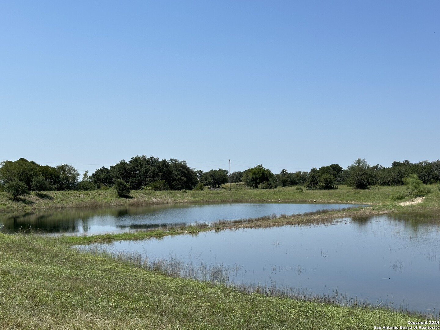 a view of a lake with houses in the background