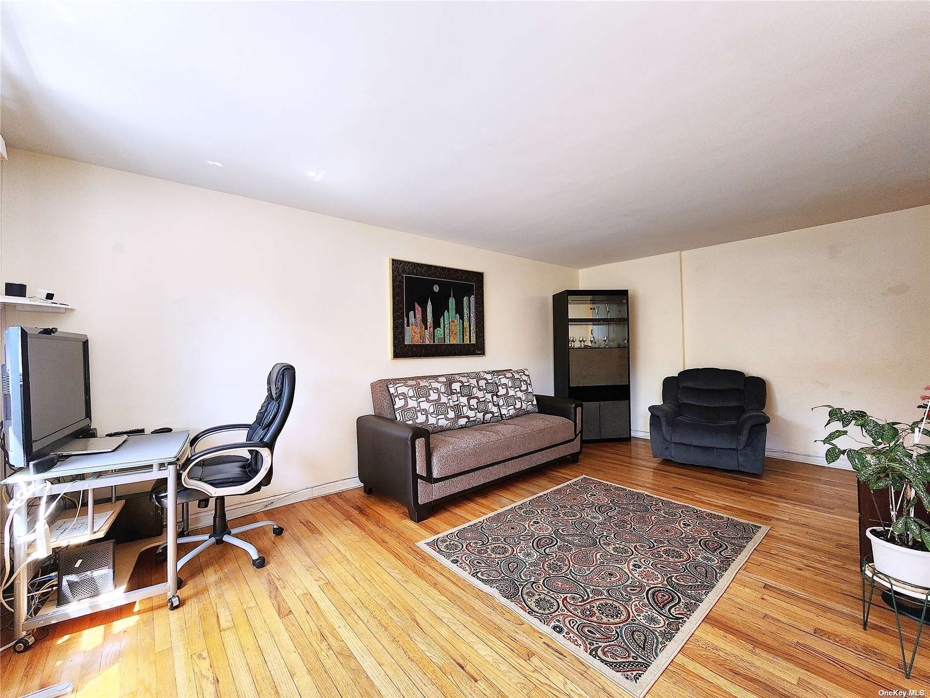 a bedroom with furniture and a rug