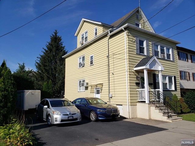 a view of a car park in front of house