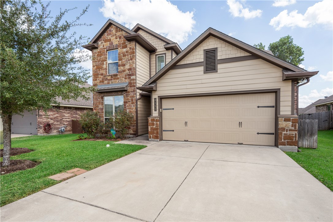 Craftsman-style house featuring a front yard and a