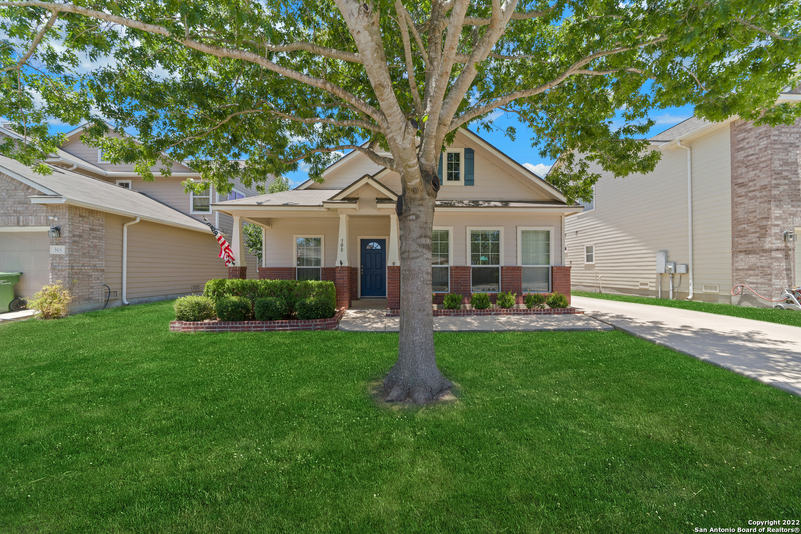 a front view of house with yard and green space