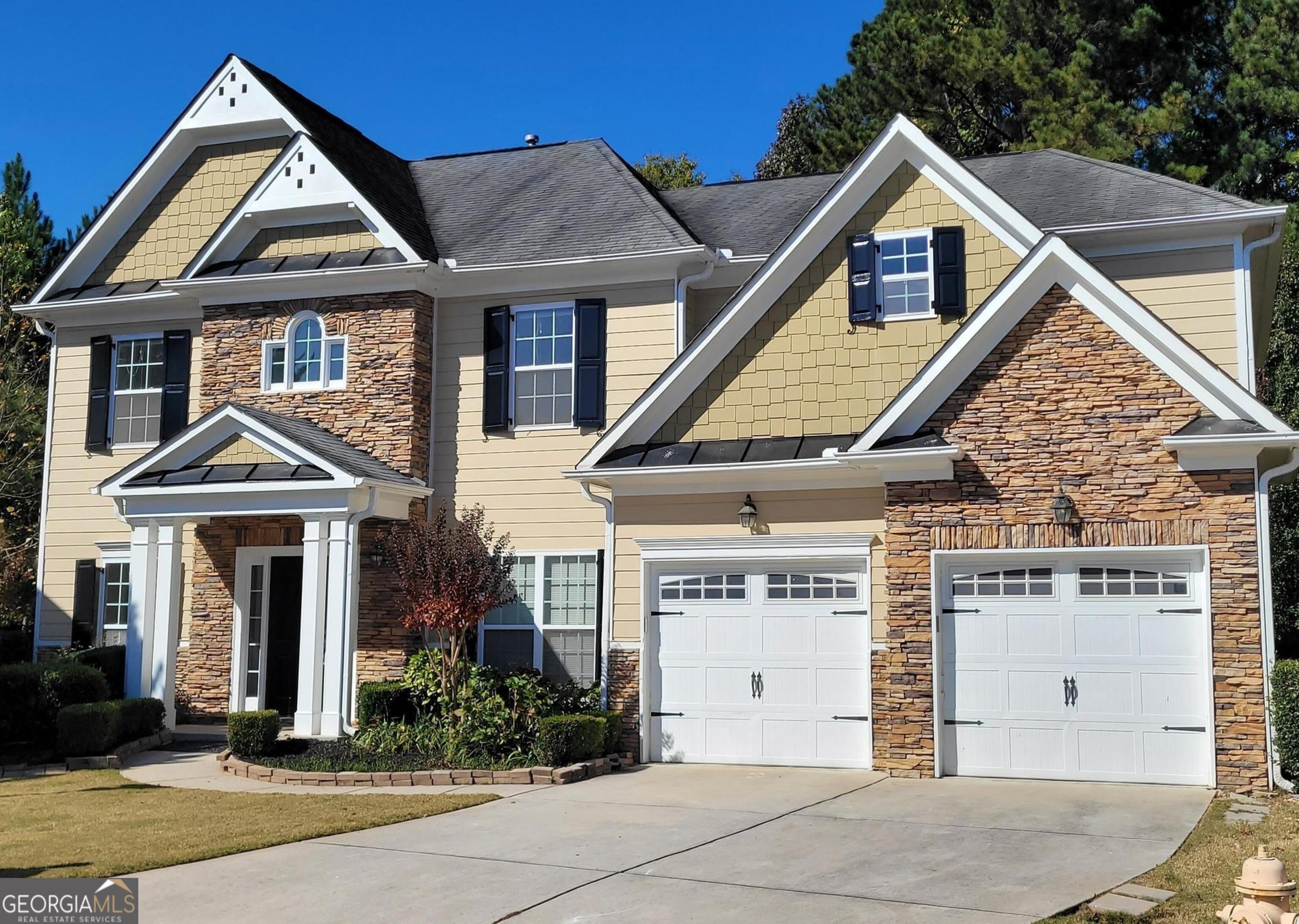 front view of a house with a yard