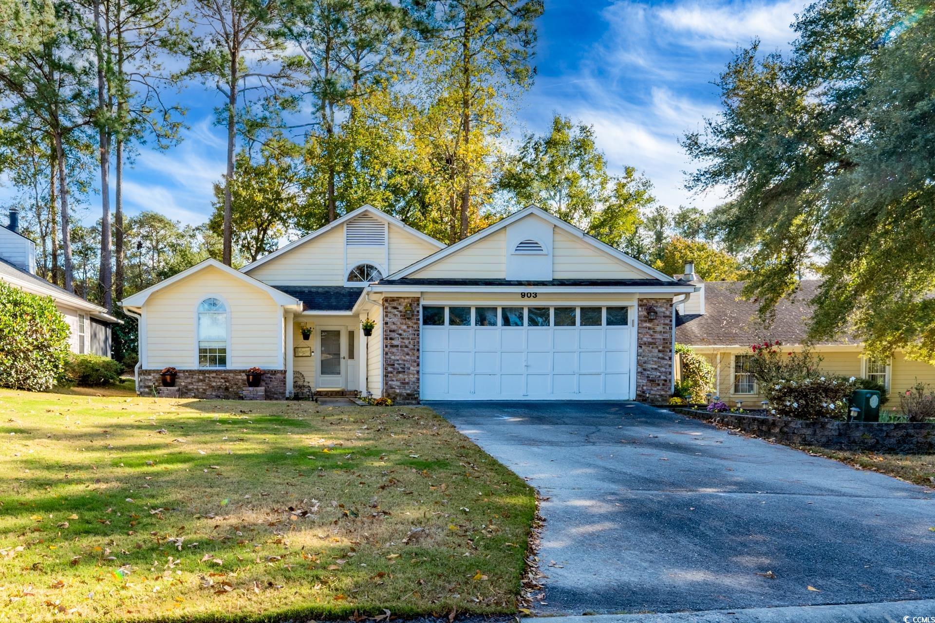 View of front of property featuring a front yard a