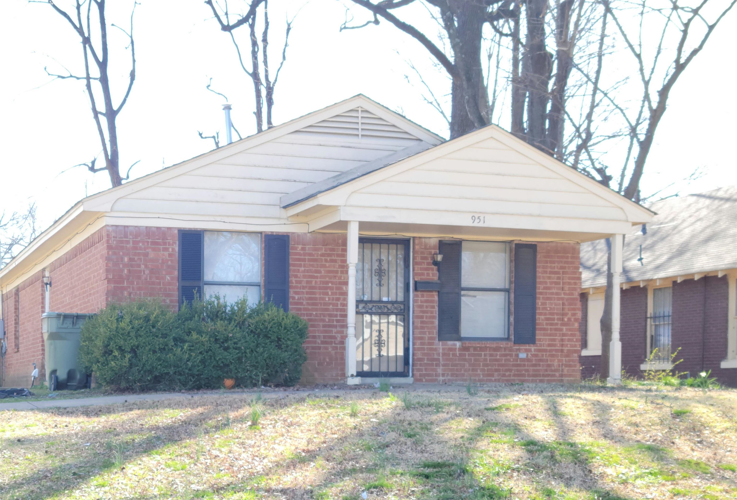 View of front of property with a front lawn and covered porch