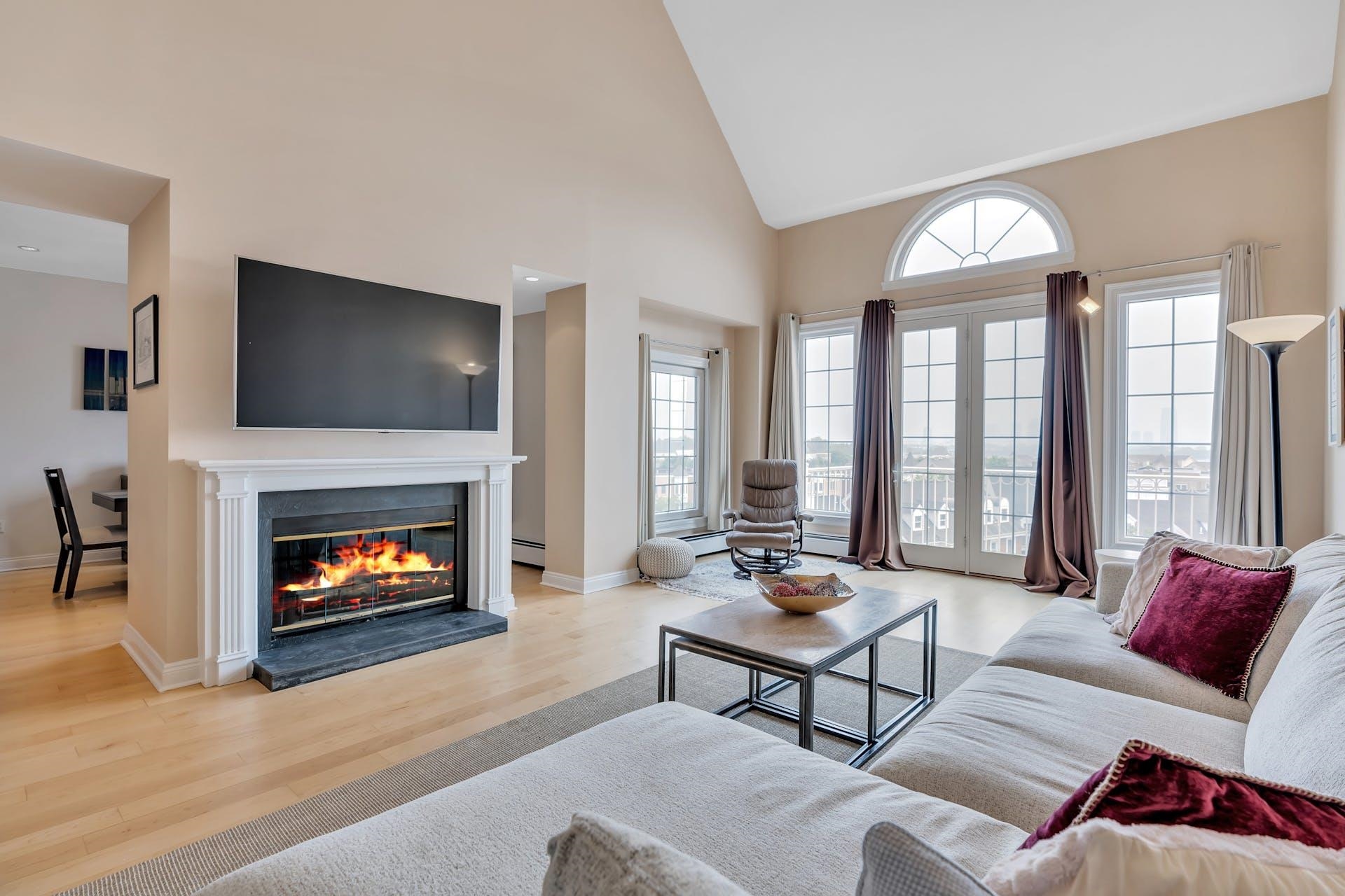 a living room with furniture and a fireplace