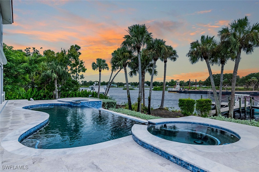 a view of a swimming pool with a yard