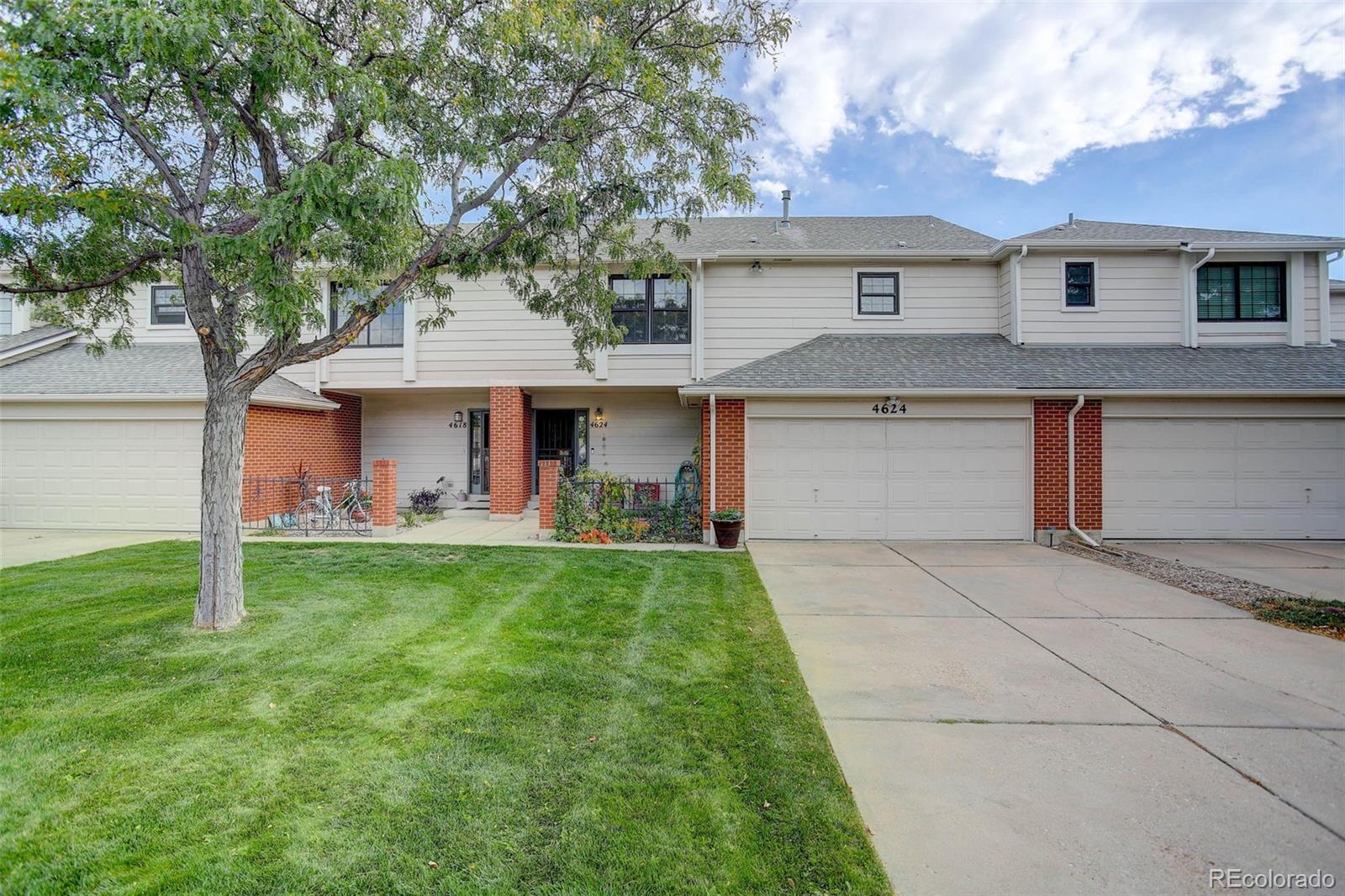 a front view of a house with yard