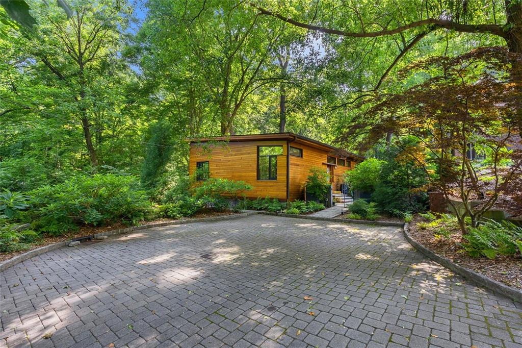 a backyard of a house with lots of green space