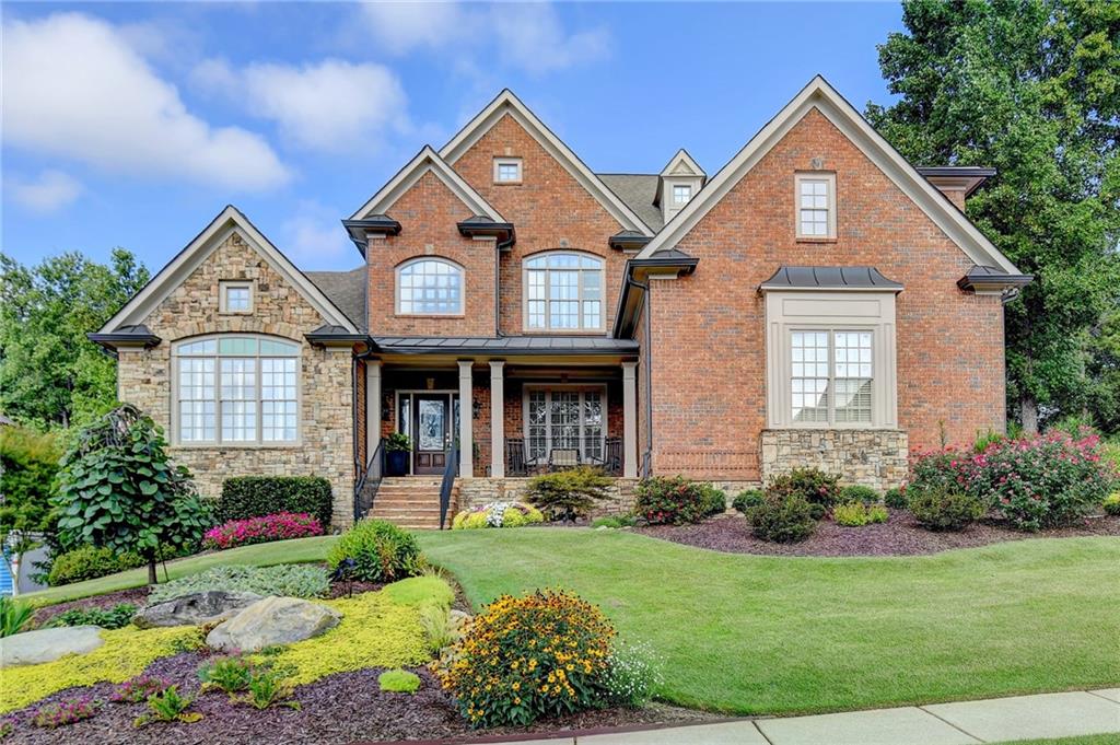 a front view of a house with garden