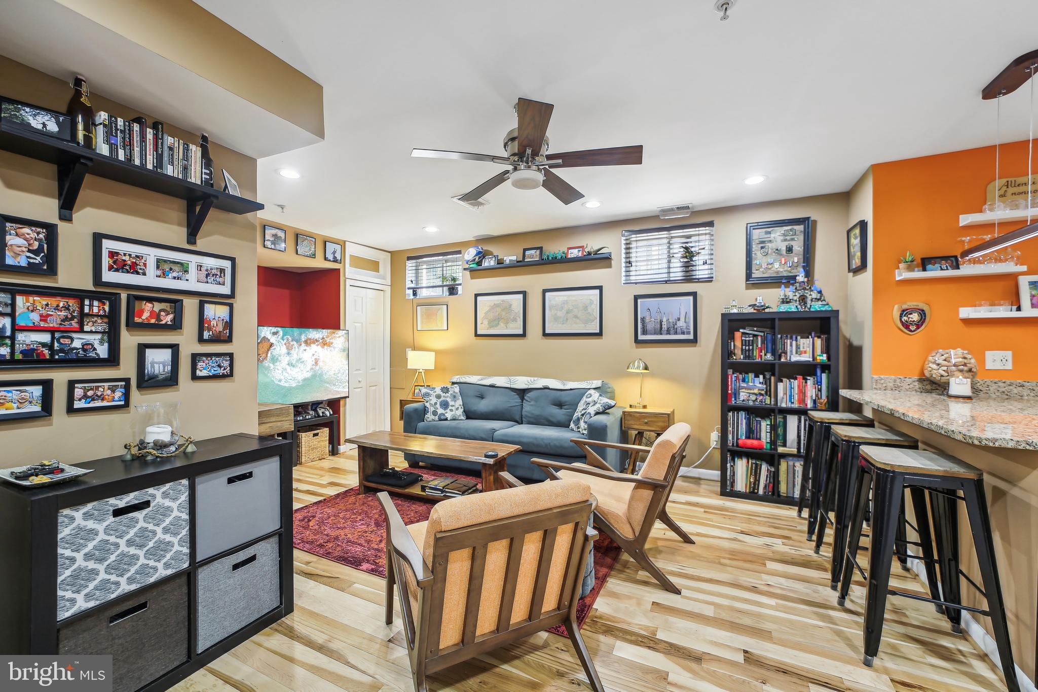 a living room with furniture a bookshelf and a bookshelf