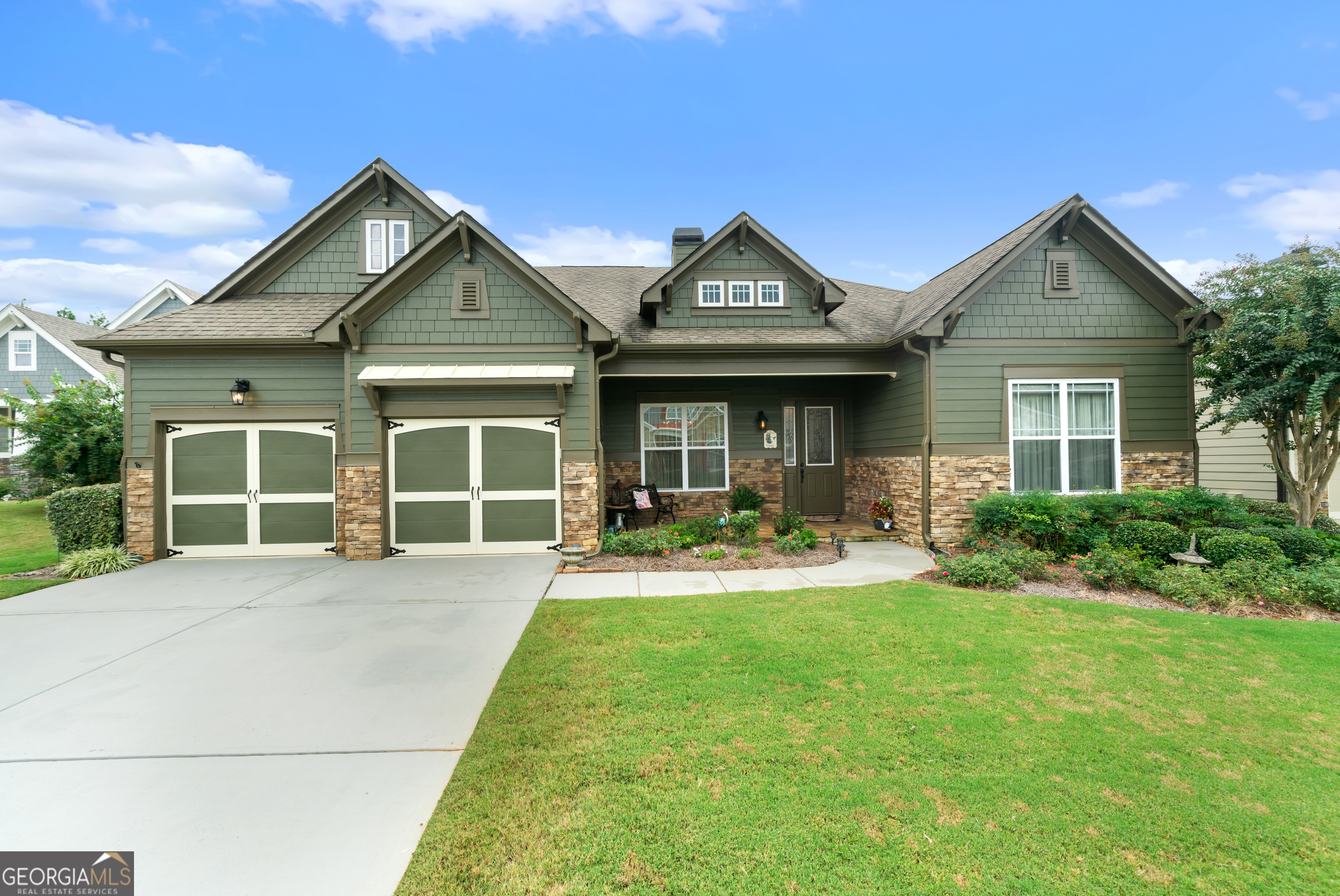 a view of house with yard and green space