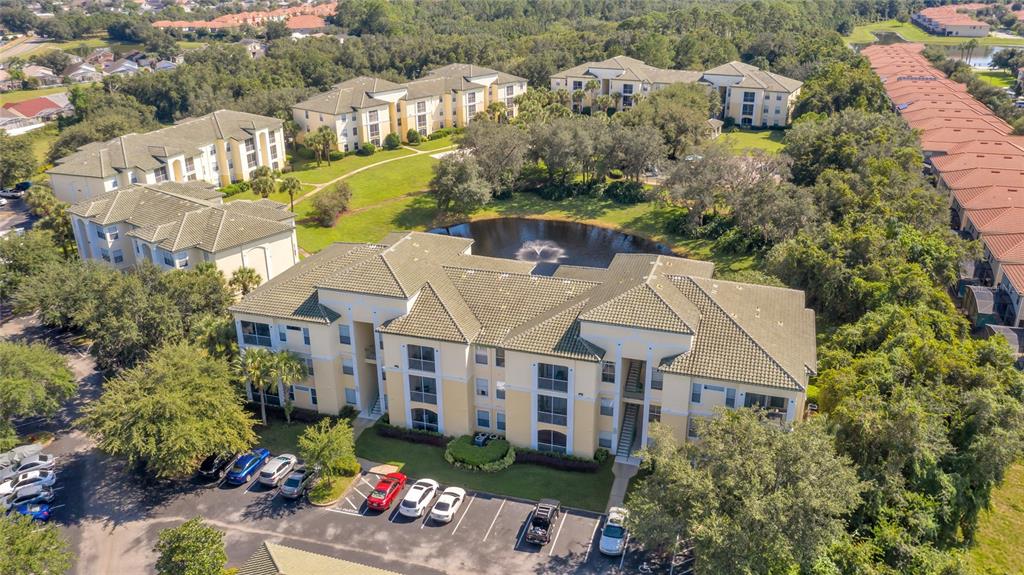 an aerial view of multiple houses with a yard