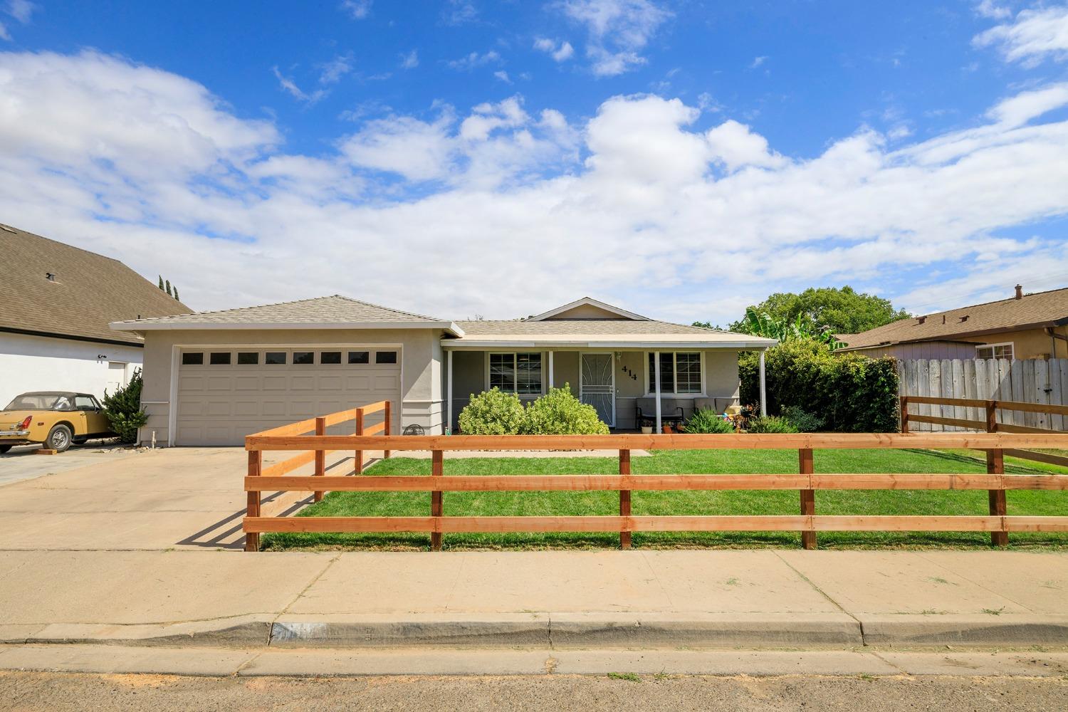 a front view of house with a yard