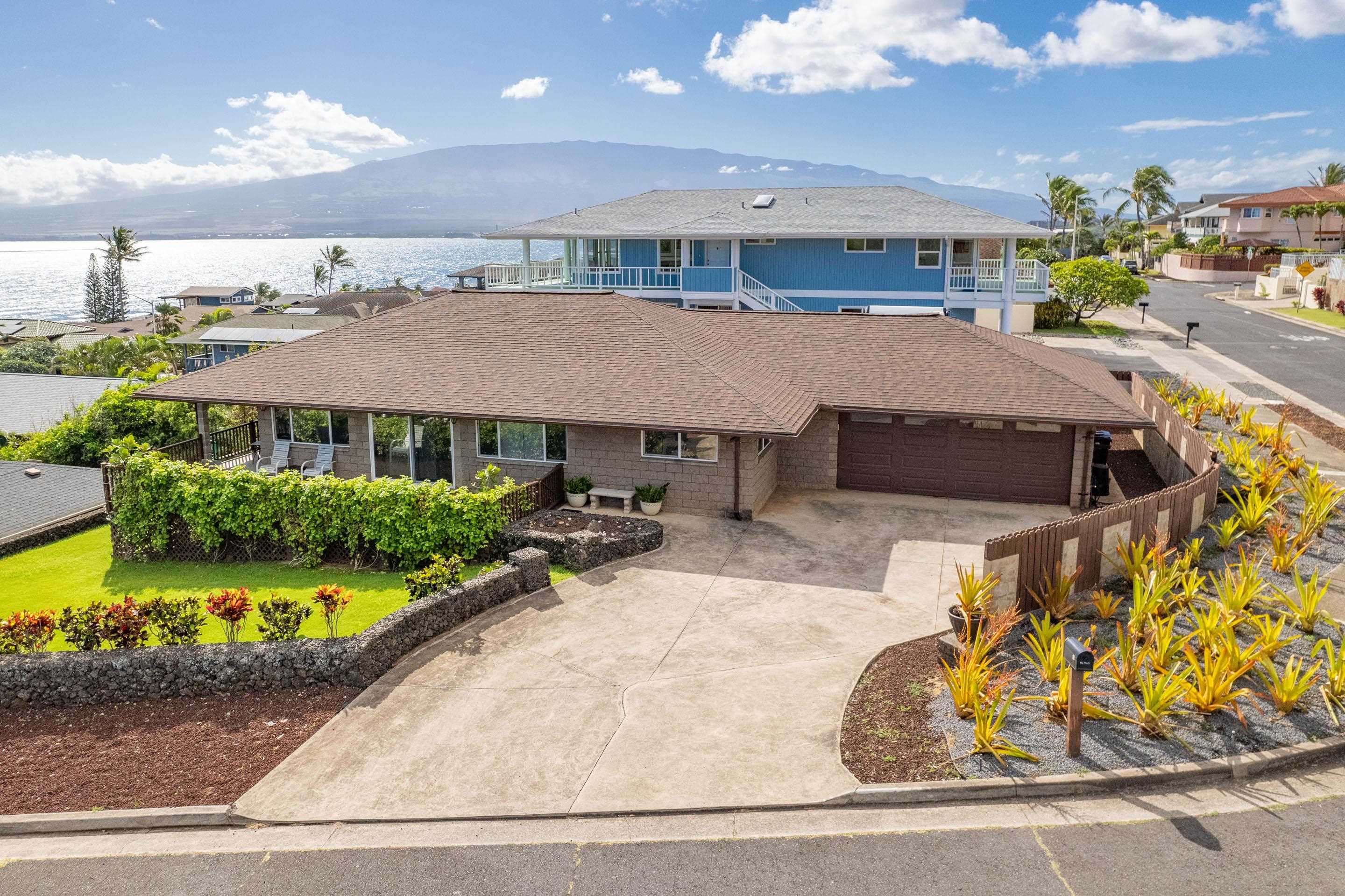 an aerial view of a house with swimming pool and patio