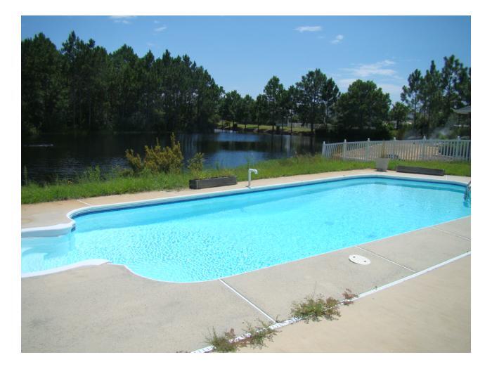 a view of a swimming pool and outdoor space