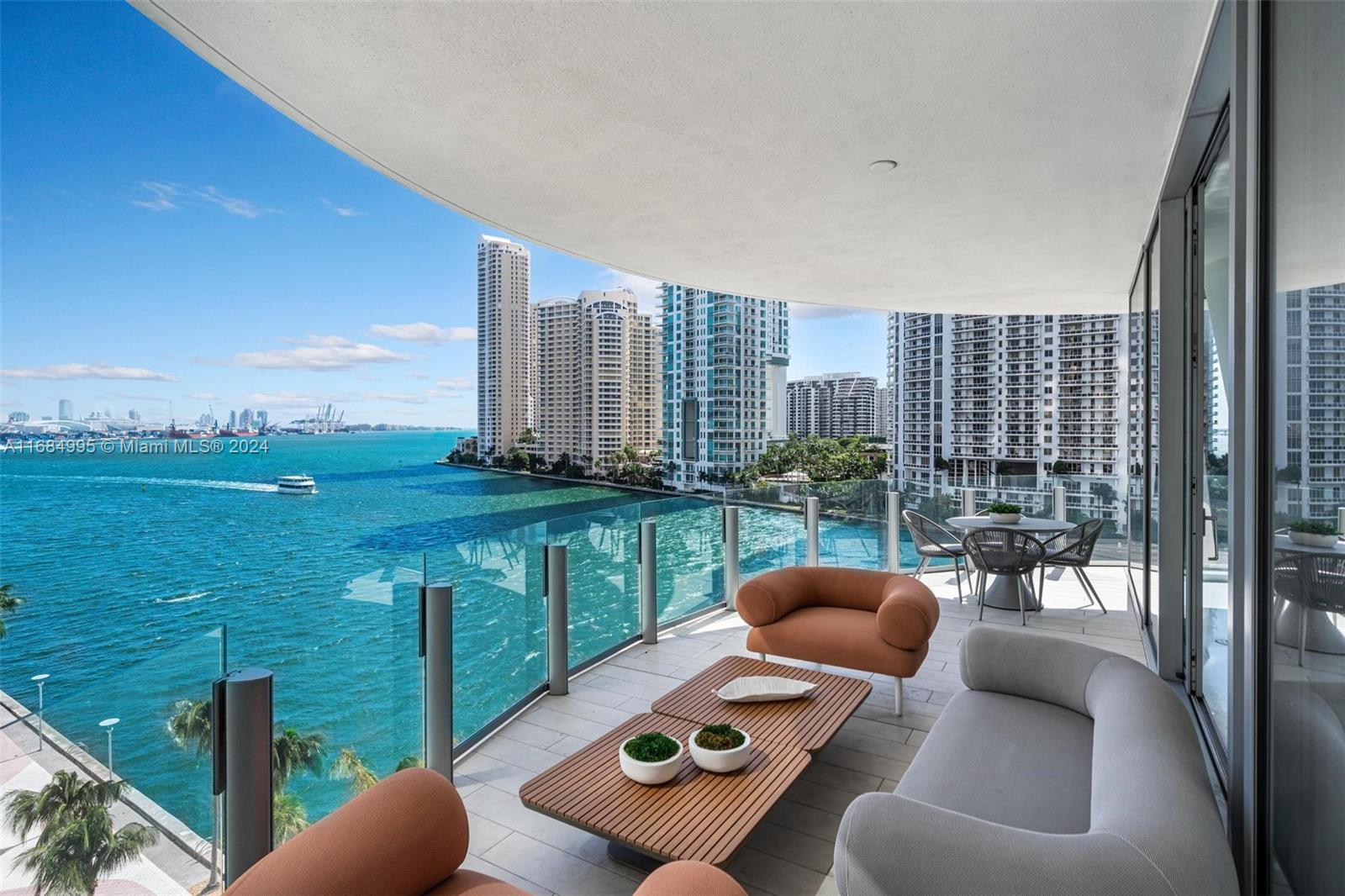 a balcony view with a couch and city view