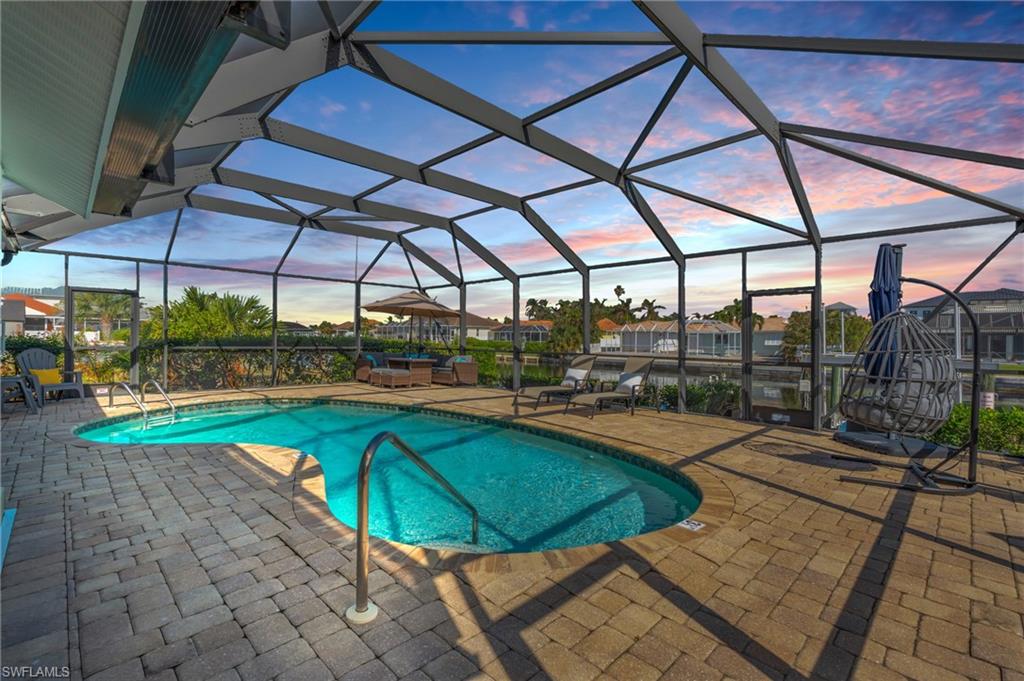 a view of a swimming pool with a patio