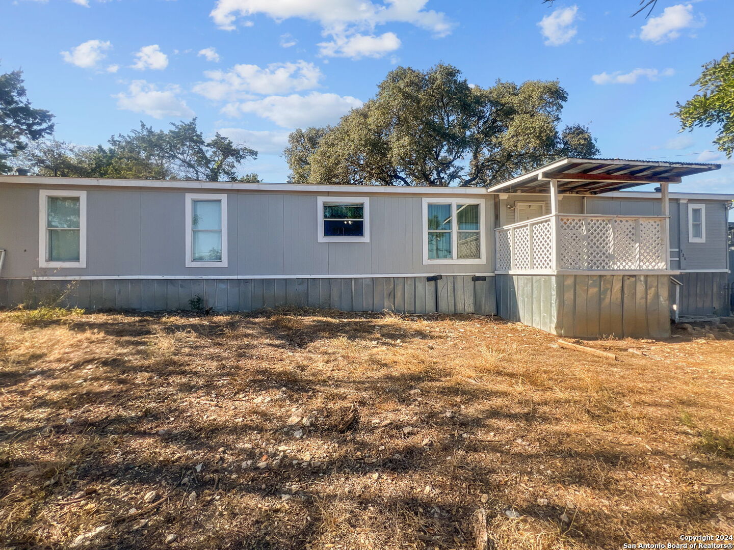 a house with trees in the background