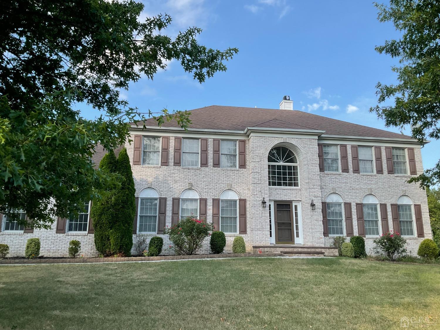 front view of a building with a yard