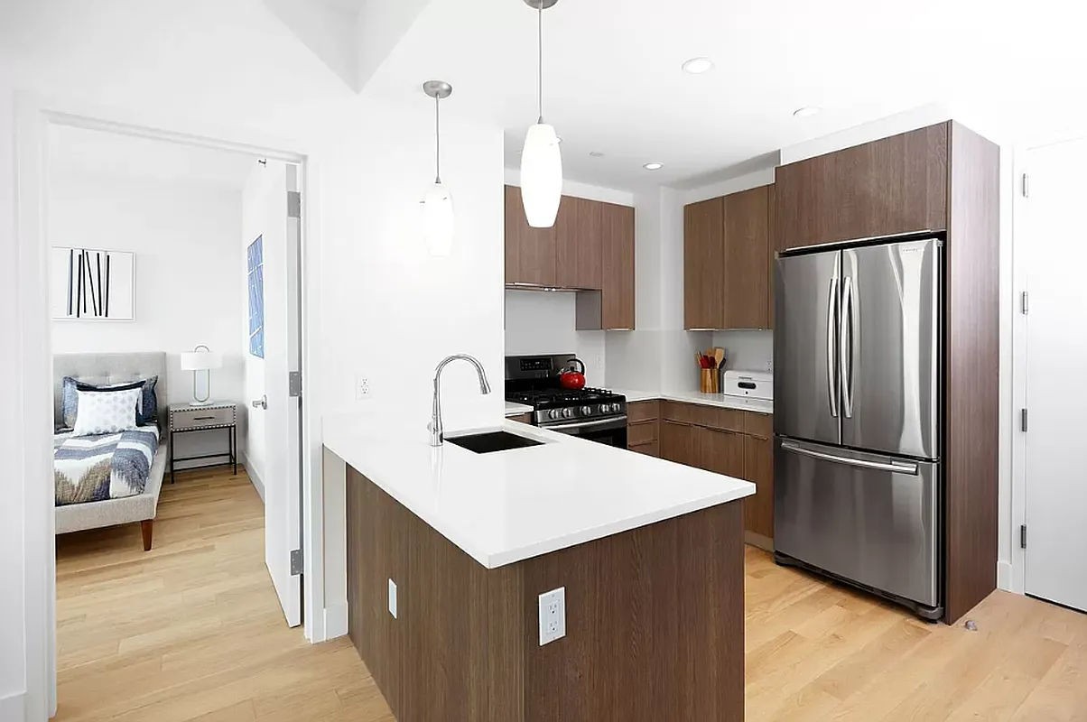 a kitchen with a refrigerator a sink and dishwasher