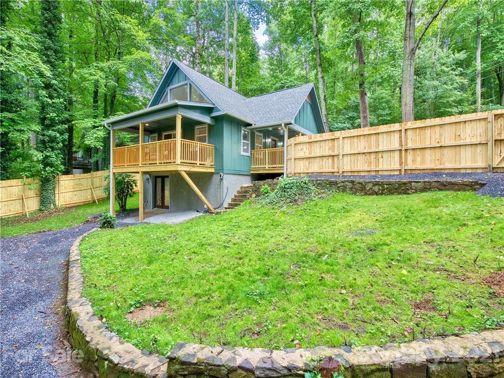 a view of house with backyard