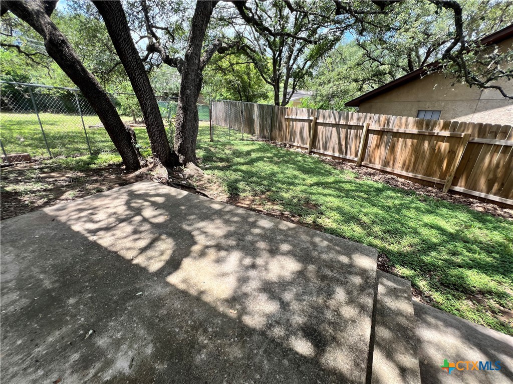 a backyard of a house with lots of green space