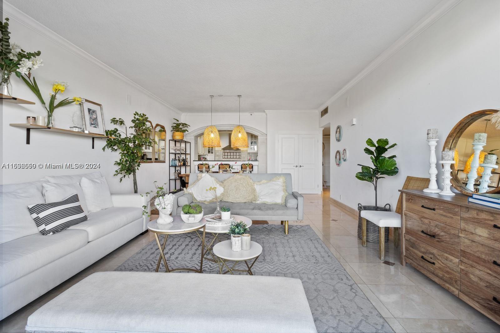 a living room with furniture and a potted plant