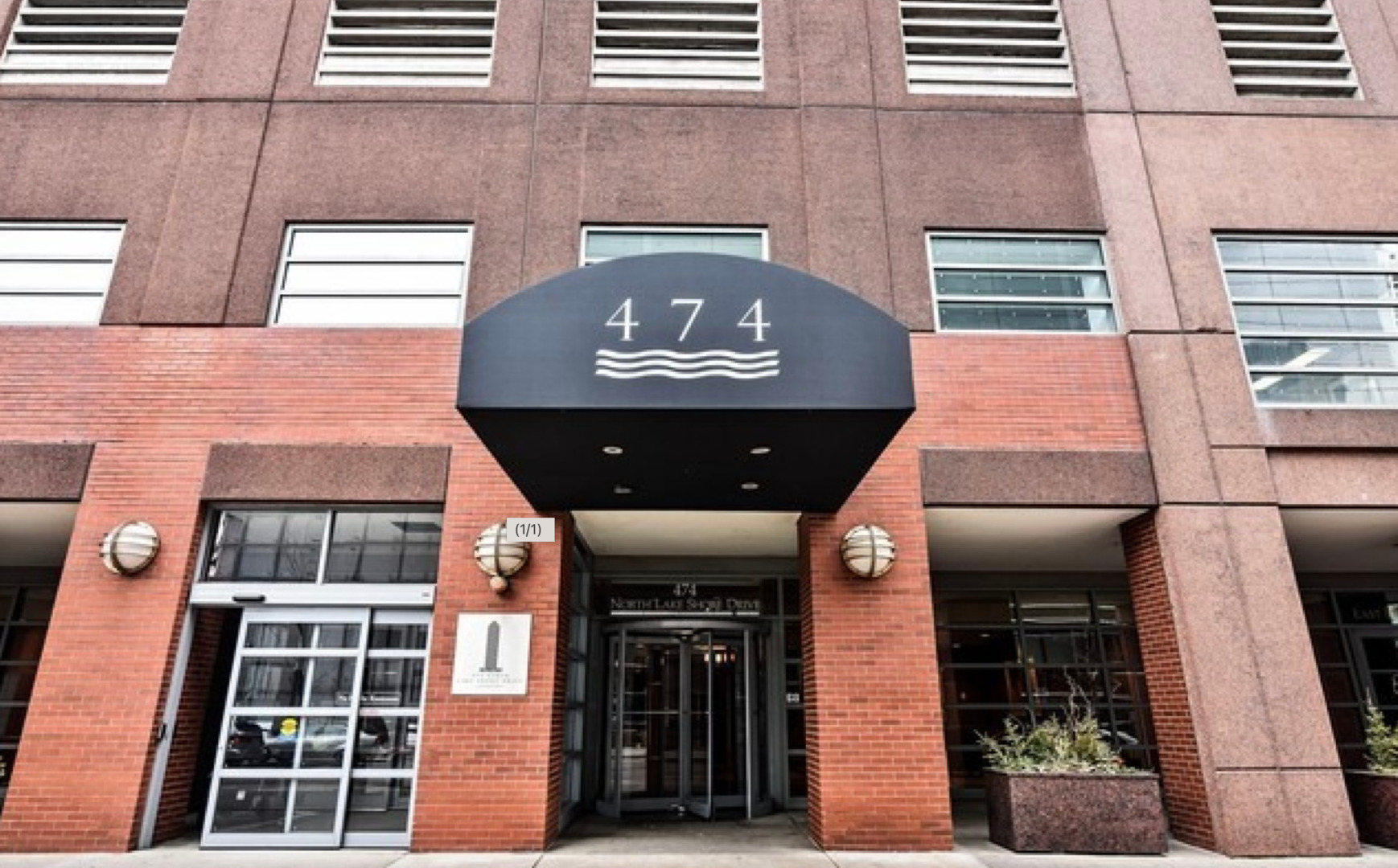 a front view of a building with a glass door