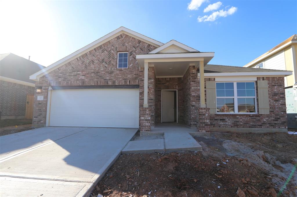 a front view of a house with yard